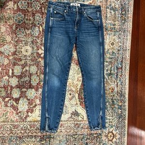 Size 27, AMO skinny with  twist zip at ankle